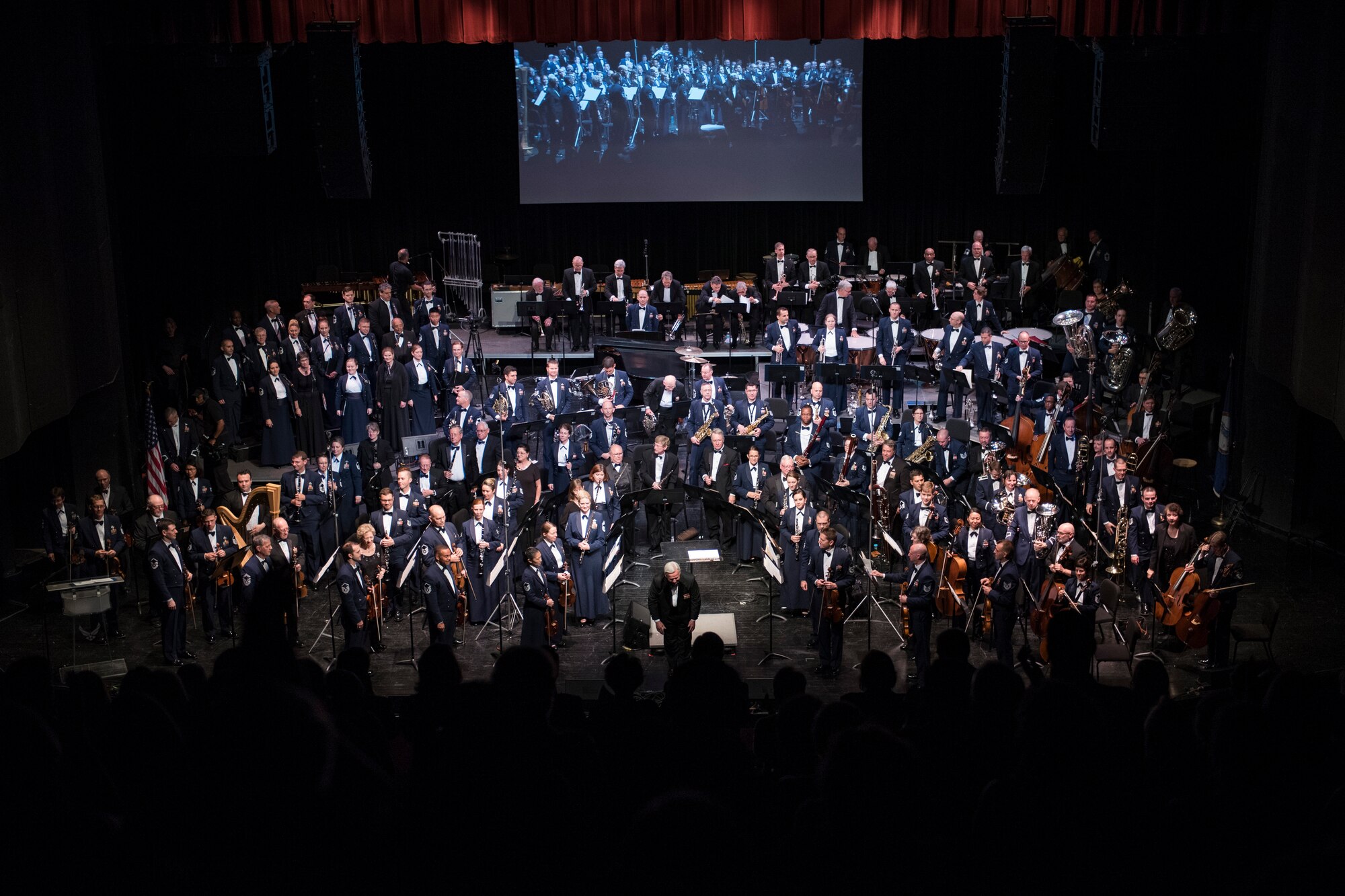 U.S. Air Force Band and band alumni stand after their group performance of ‘The Battle Hymn of the Republic’ during the U.S. Air Force Band’s 75th Anniversary celebration June 11, 2016, at George Mason University’s Center for the Arts Concert Hall in Fairfax, Va. ‘The Battle Hymn of the Republic’ went straight into the concert finale, the Air Force Song. (U.S. Air Force photo by Airman 1st Class Philip Bryant)