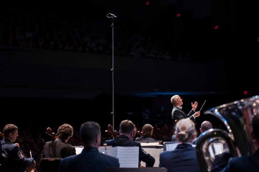 Col. Larry H. Lang, U.S. Air Force Band commander and conductor, conducts on stage during the U.S. Air Force Band’s 75th Anniversary celebration June 11, 2016, at George Mason University’s Center for the Arts Concert Hall in Fairfax, Va. The anniversary was the first reunion concert that included U.S. Air Force Band alumni conductors and musicians. (U.S. Air Force photo by Airman 1st Class Philip Bryant)