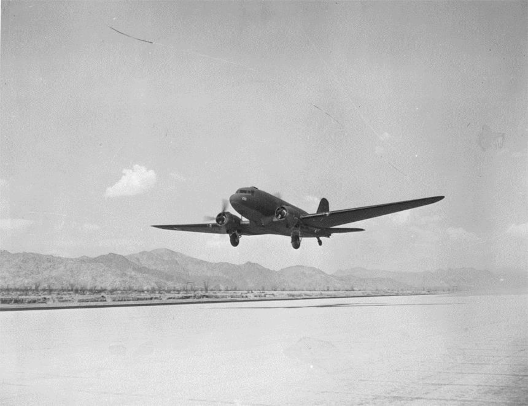 A Douglas C-47 Skytrain transport, similar to the kind used by Portland’s 16th Transport Squadron in 1941-1942, is seen in this picture about to land at the new airfield at Camp Young, Indio, California, circa 1942.  (U.S. Air Force Photo)