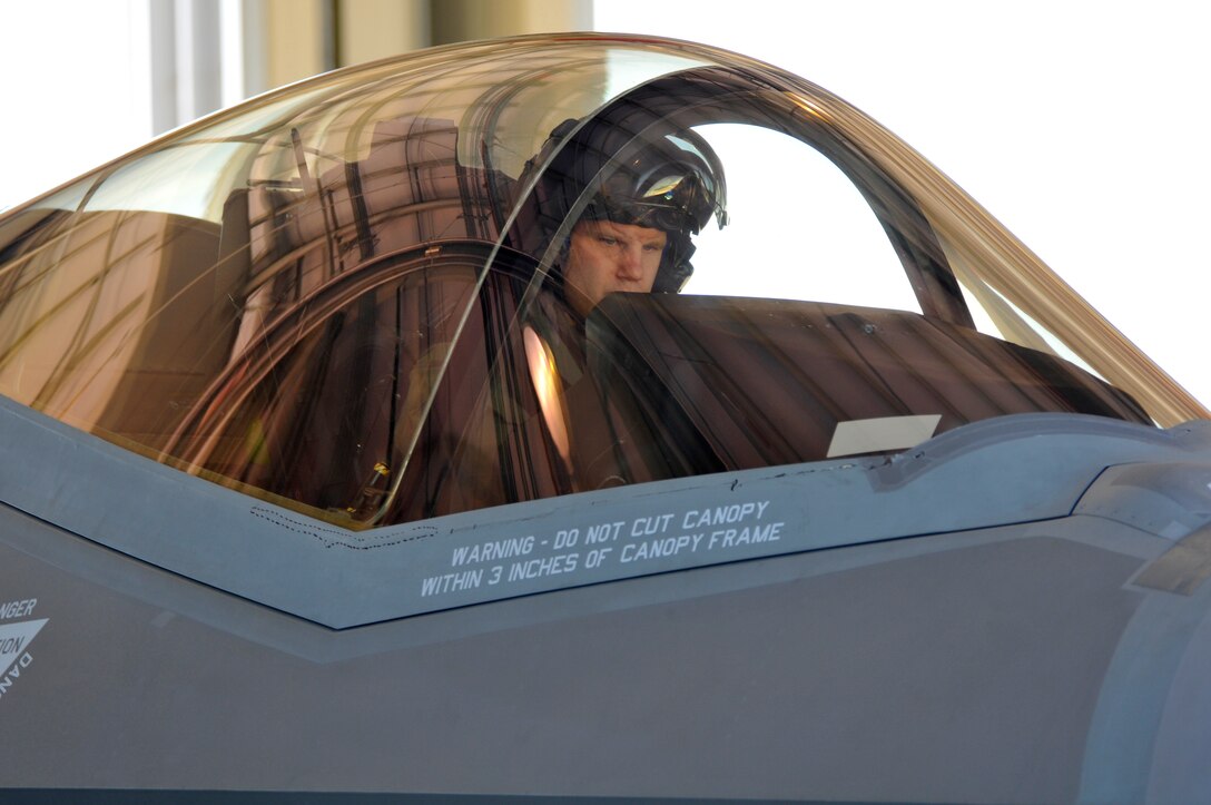 U.S. Air Force Maj. Will Andreotta, F-35 Lightning II fighter pilot from the 56th Fighter Wing, Luke Air Force Base, Arizona, prepares his aircraft for launch while parked in a military aircraft shelter at the Atlantic City International Airport in Egg Harbor Township, N.J. on May 29, 2016. Pilots and crew from the USAF F-35 Heritage Flight Team made a stop at the 177th Fighter Wing of the New Jersey Air National Guard on the way to their performance at the Jones Beach Airshow in Wantagh, New York on May 28 and 29. (U.S. Air National Guard photo by Master Sgt. Andrew J. Moseley/Released)