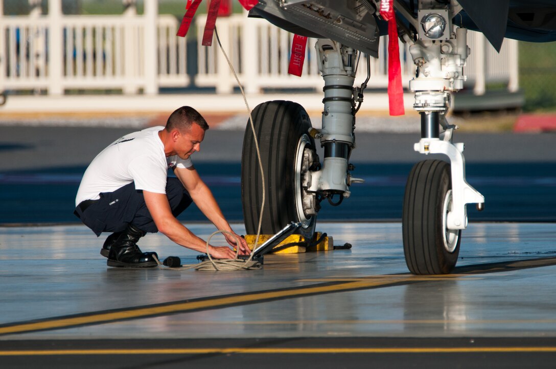 U.S. Air Force Tech. Sgt. Robert James, F-35 Lightining II crew chief with the 56th Fighter Wing, Luke Air Force Base, Arizona, climbs the aircraft's built in ladder to safe the cockpit at the Atlantic City International Airport in Egg Harbor Township, N.J. on May 26, 2016. Pilots and crew from the USAF F-35 Heritage Flight Team made a stop at the 177th Fighter Wing of the New Jersey Air National Guard on the way to their performance at the Jones Beach Airshow in Wantagh, New York on May 28 and 29. (U.S. Air National Guard photo by Master Sgt. Andrew J. Moseley/Released)