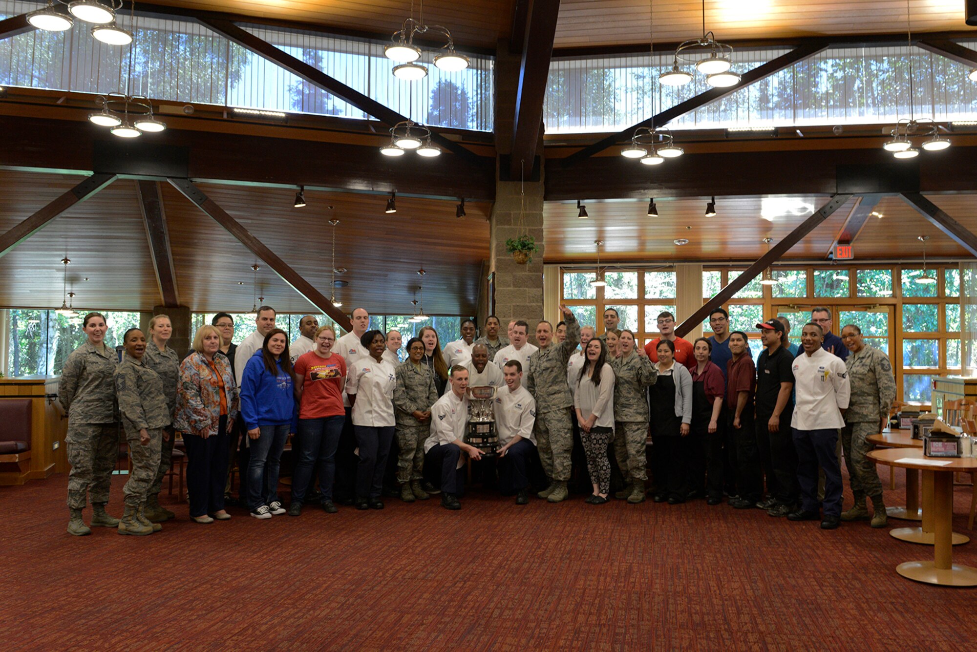 Air Force Lt. Col Christopher Busque, 673d Force Support Squadron commander, presents the 2016 John L. Hennessy Award to the Iditarod Dining Facility personnel at Joint Base Elmendorf-Richardson, Alaska, June 8, 2016. The award is not only a high-level Air Force award but benefits all those who receive it if they decide to pursue a culinary career outside of the military. (U.S. Air Force photo by Airman 1st Class Valerie Monroy)
