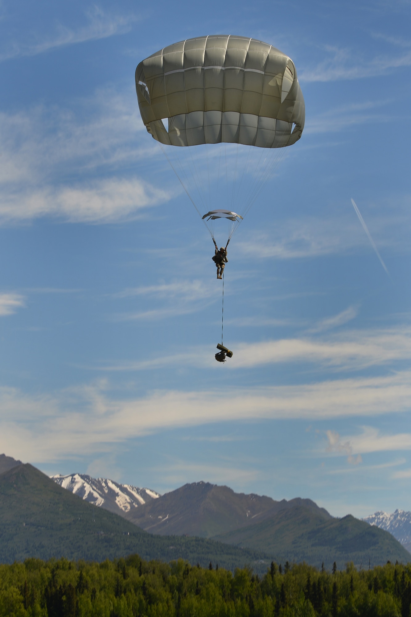 Paratroopers assigned to the 4th Infantry Brigade Combat Team (Airborne), 25th Infantry Division, U.S. Army Alaska, and the Japan Ground Self-Defense Force execute an airborne proficiency operation, and coordination for follow-on training at Joint Base Elmendorf-Richardson, Alaska, June 9, 2016, during Exercise Arctic Aurora. Arctic Aurora is a yearly bilateral training exercise involving elements of the Spartan Brigade and the JGSDF, which focuses on strengthening ties between the two by executing combined small unit airborne proficiency operations and basic small arms marksmanship. (U.S. Air Force photo by Airman 1st Class Valerie Monroy)