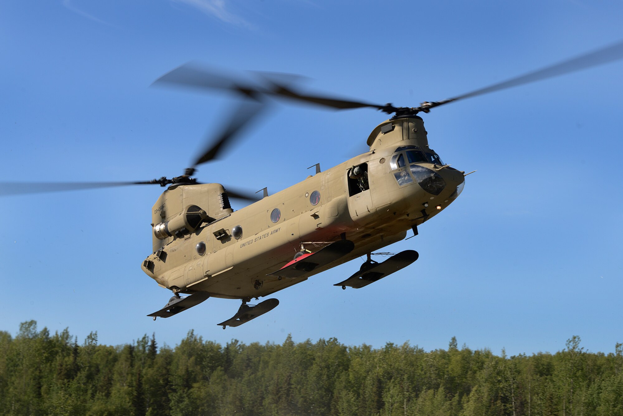 Paratroopers assigned to the 4th Infantry Brigade Combat Team (Airborne), 25th Infantry Division, U.S. Army Alaska, and the Japan Ground Self-Defense Force execute an airborne proficiency operation, and coordination for follow-on training at Joint Base Elmendorf-Richardson, Alaska, June 9, 2016, during Exercise Arctic Aurora. Arctic Aurora is a yearly bilateral training exercise involving elements of the Spartan Brigade and the JGSDF, which focuses on strengthening ties between the two by executing combined small unit airborne proficiency operations and basic small arms marksmanship. (U.S. Air Force photo by Airman 1st Class Valerie Monroy)