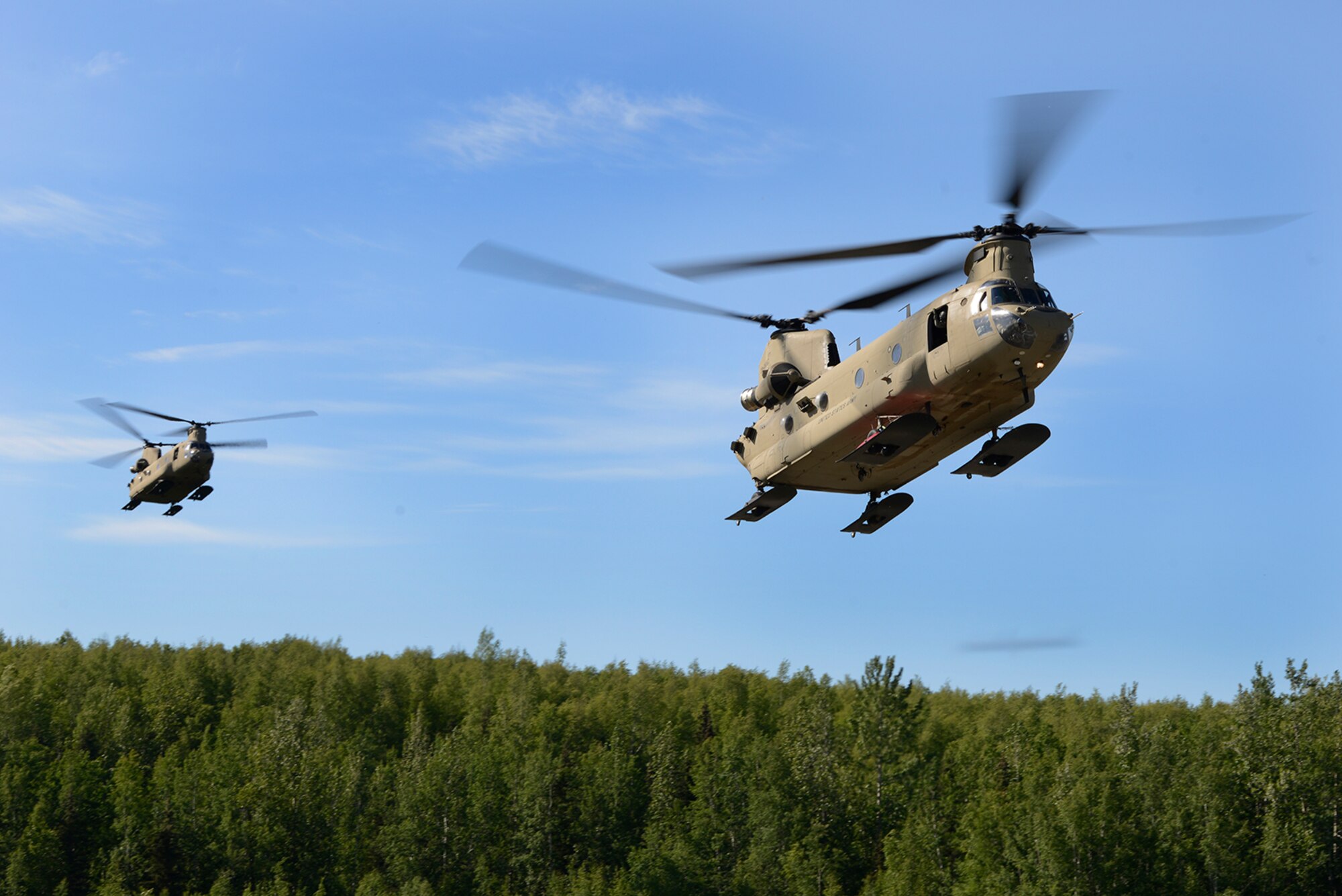 Paratroopers assigned to the 4th Infantry Brigade Combat Team (Airborne), 25th Infantry Division, U.S. Army Alaska, and the Japan Ground Self-Defense Force execute an airborne proficiency operation, and coordination for follow-on training at Joint Base Elmendorf-Richardson, Alaska, June 9, 2016, during Exercise Arctic Aurora. Arctic Aurora is a yearly bilateral training exercise involving elements of the Spartan Brigade and the JGSDF, which focuses on strengthening ties between the two by executing combined small unit airborne proficiency operations and basic small arms marksmanship. (U.S. Air Force photo by Airman 1st Class Valerie Monroy)