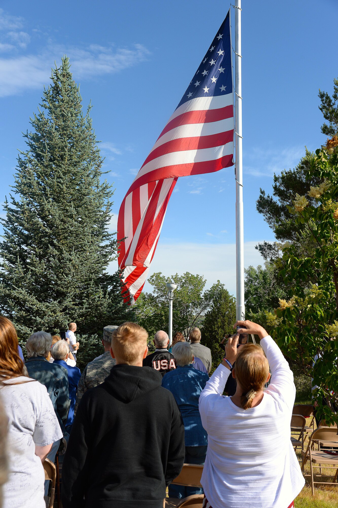 Community members from Great Falls, Mont., celebrate Flag Day June 14, 2016, at Overlook Park. Civilians and military members assigned to the 341st Missile Wing and the 120th Airlift Wing came together to honor the symbol of the nation’s resiliency and freedom. (U.S. Air Force photo/Airman 1st Class Magen M. Reeves)