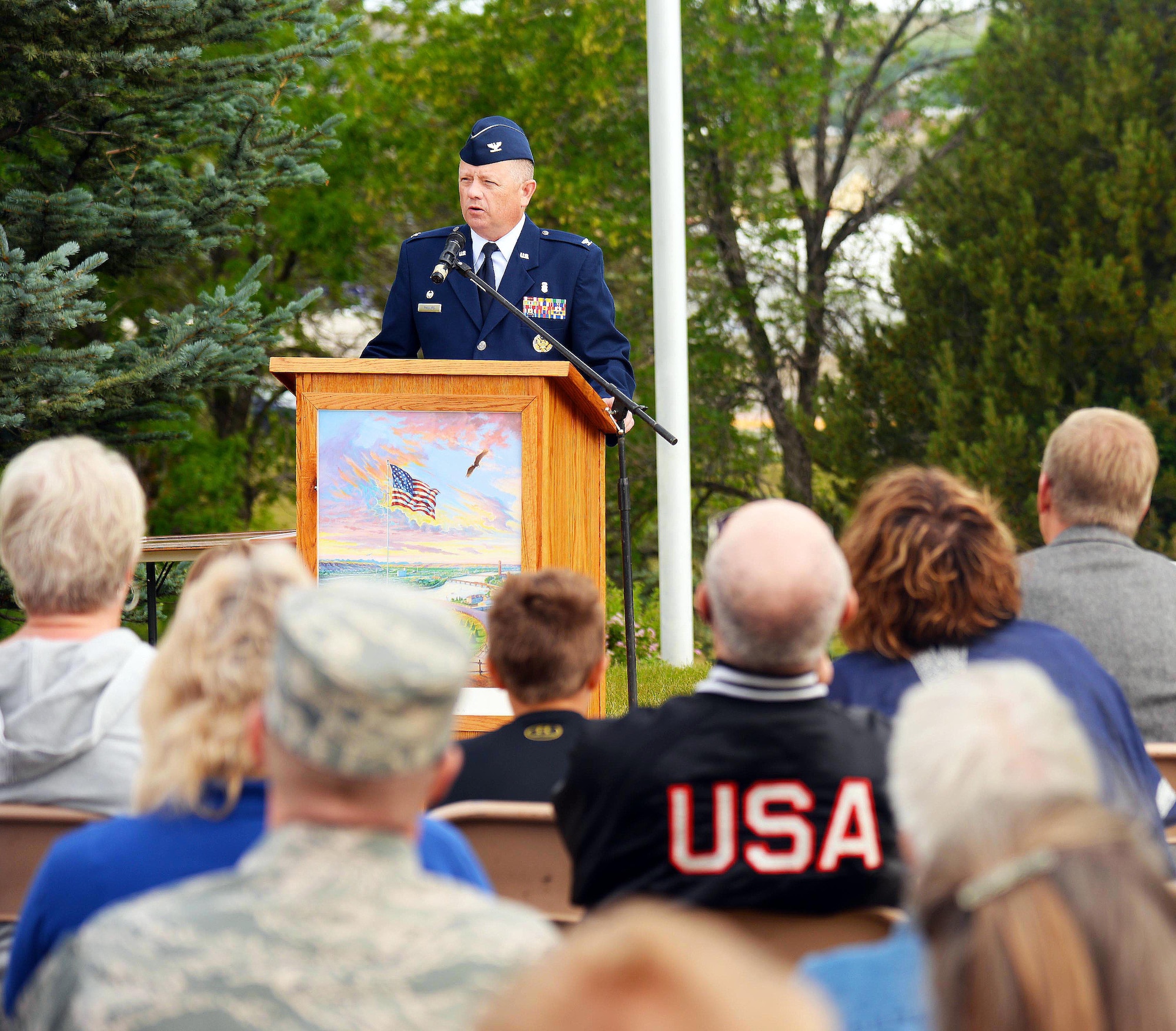 Col. Christopher Phillips, 341st Medical Group commander, addresses an audience on Flag Day June 14, 2016, in Great Falls, Mont. Phillips spoke of how he felt the flag is a symbol for service members, of patriotism and hope. (U.S. Air Force photo/Airman 1st Class Magen M. Reeves)