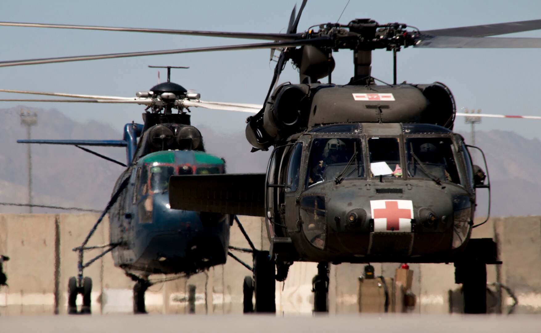 An Army National Guard UH-60 Black Hawk helicopter crewed by Soldiers from Arkansas and West Virginia’s 1st Battalion, 104th Aviation Regiment, 40th Combat Aviation Brigade, lands at Forward Operating Base Dahlke, Afghanistan, May 19, 2016. (Army photo by Staff Sgt. Ian Kummer)