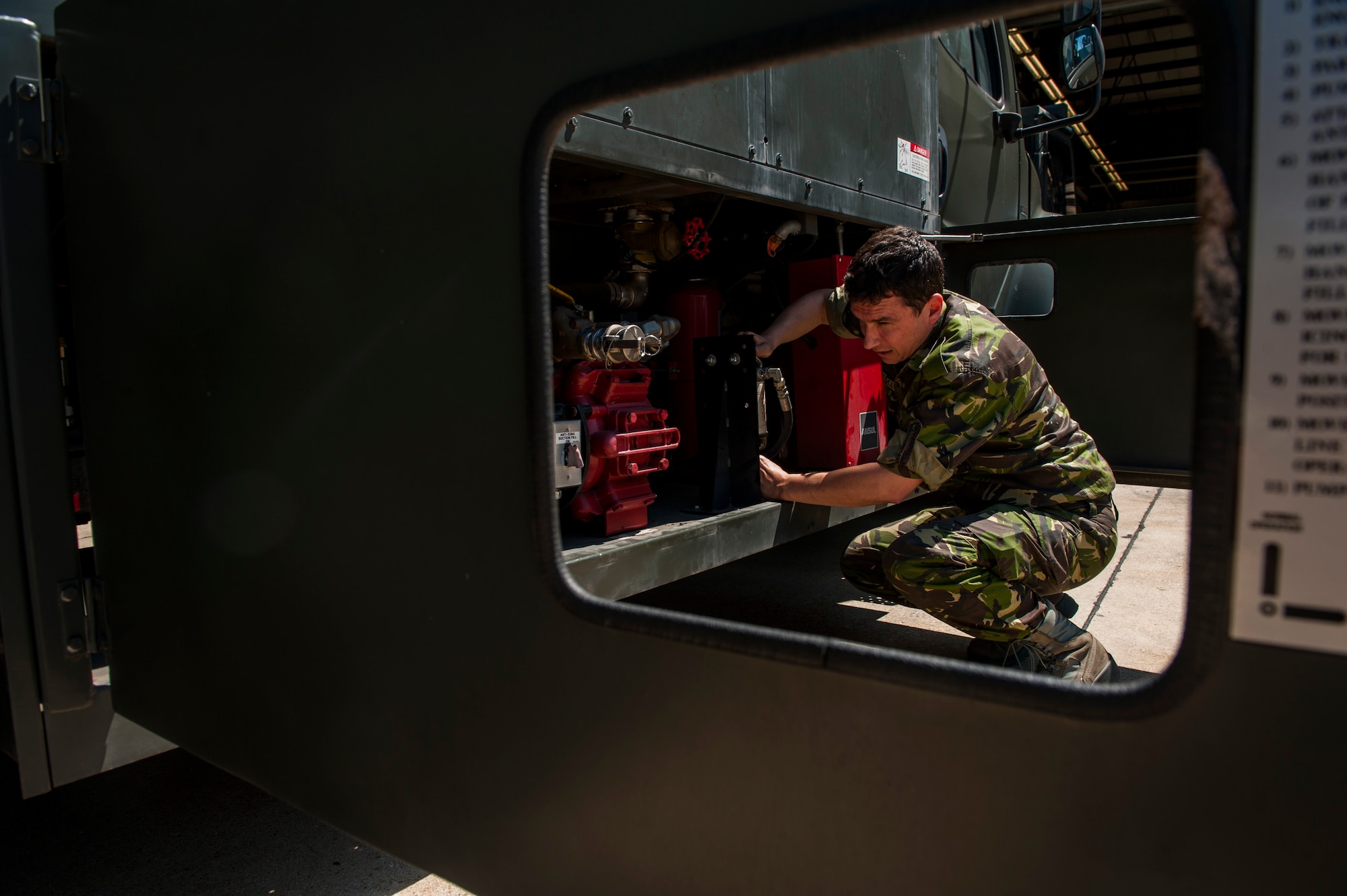 Romanian Land Forces Warrant Officer Bogden Cosma, Heavy Airlift Wing vehicle maintenance NCO-in-charge assigned to Papa Air Base, Hungary, works on an aircraft deicer during the lab portion of the deicer qualification training course at the European Transportation Training Center on Spangdahlem Air Base, Germany, June 9, 2016. Cosma attended the training course at the 52nd Fighter Wing to further his skillset and knowledge base essential for his job in Hungary. (U.S. Air Force photo by Airman 1st Class Timothy Kim/Released)