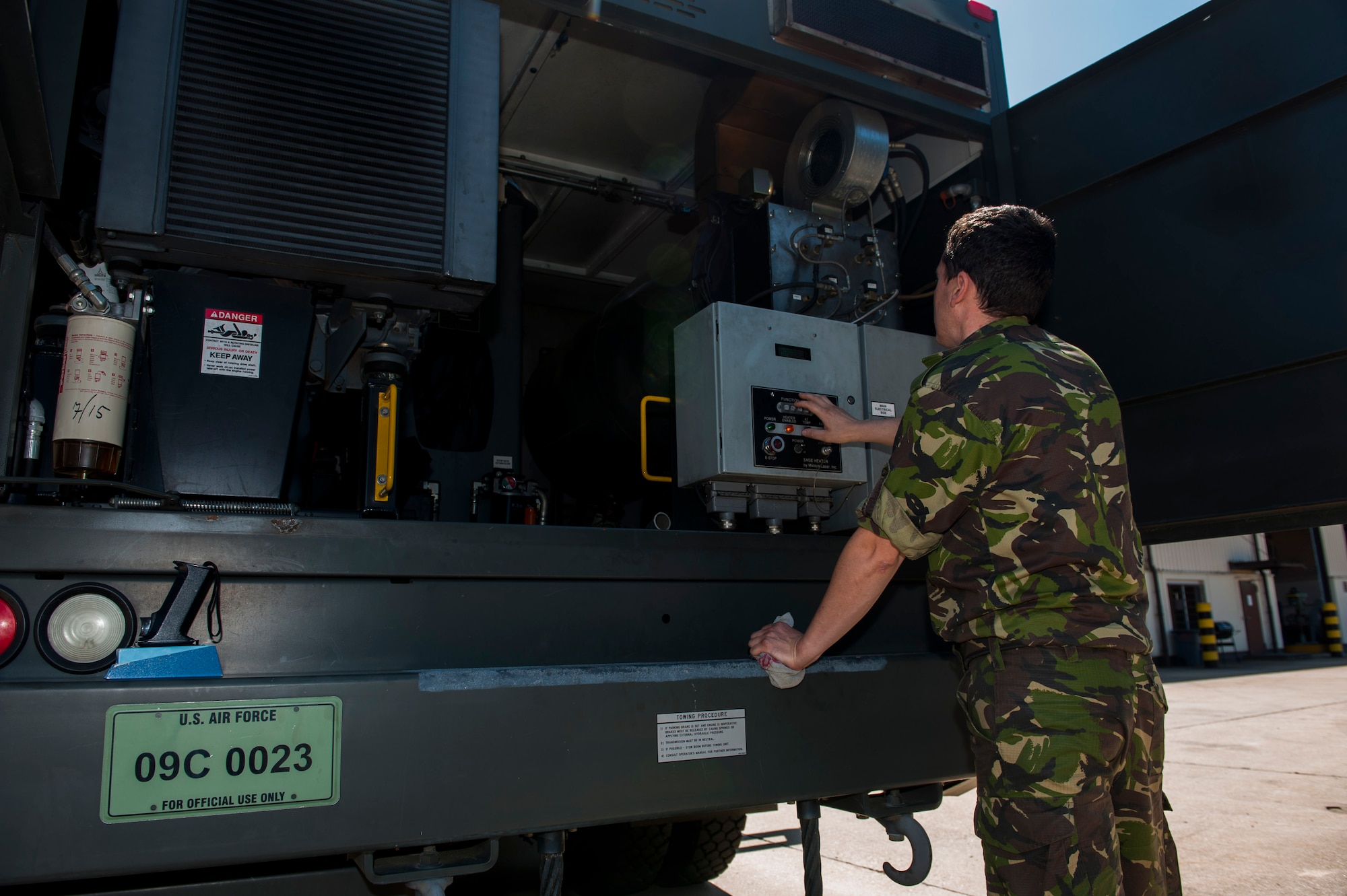 Romanian Land Forces Warrant Officer Bogden Cosma, Heavy Airlift Wing vehicle maintenance NCO-in-charge assigned to Papa Air Base, Hungary, configures an aircraft deicer during the lab portion of the deicer qualification training course at the European Transportation Training Center on Spangdahlem Air Base, Germany, June 9, 2016. The training course teaches students on maintaining, assessing, diagnosing and fixing the truck when necessary, as the vehicle is essential in ensuring flying missions are not hindered. (U.S. Air Force photo by Airman 1st Class Timothy Kim/Released)