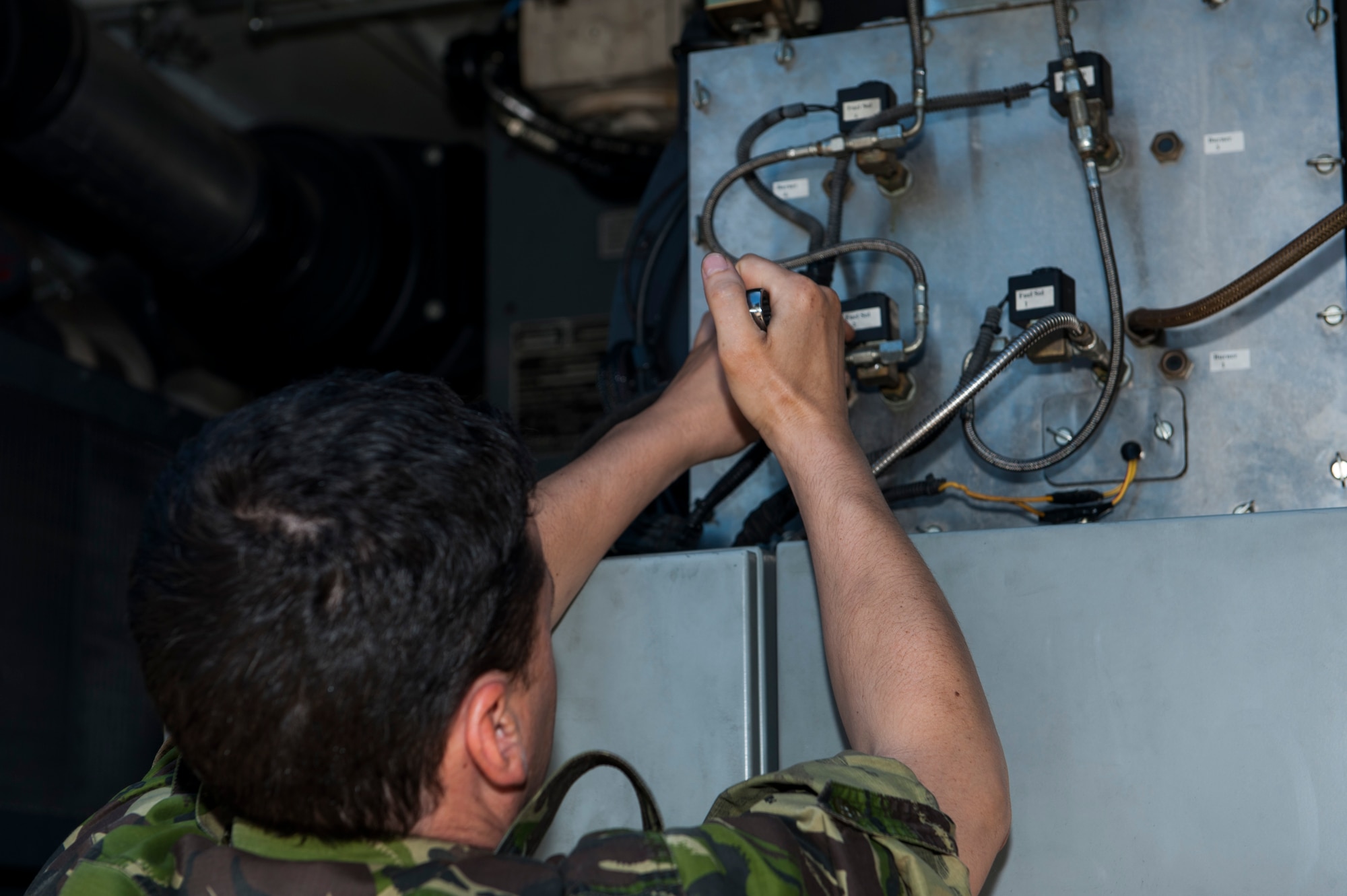 Romanian Land Forces Warrant Officer Bogden Cosma, Heavy Airlift Wing vehicle maintenance NCO-in-charge assigned to Papa Air Base, Hungary, configures an aircraft deicer during the lab portion of the deicer qualification training course at the European Transportation Training Center on Spangdahlem Air Base, Germany, June 9, 2016. The 52nd Logistics Readiness Squadron’s training center hosted Cosma, their first coalition forces partner student, for the course. (U.S. Air Force photo by Airman 1st Class Timothy Kim/Released)