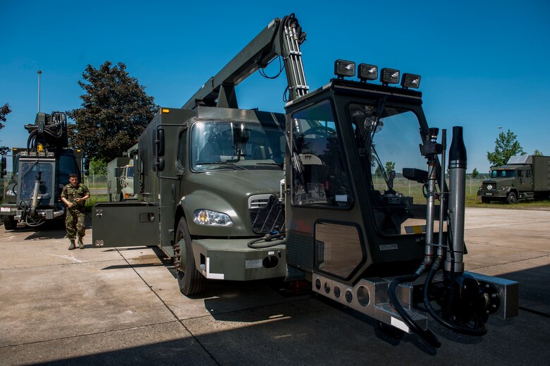 Romanian Land Forces Warrant Officer Bogden Cosma, Heavy Airlift Wing vehicle maintenance NCO-in-charge assigned to Papa Air Base, Hungary, assesses the Global Deicer during the deicer qualification training course at the European Transportation Training Center on Spangdahlem Air Base, Germany, June 9, 2016. Cosma completed the 80-hour-long class studying the deicer’s advanced hydraulic, pneumatic and electrical systems to further his role in the HAW’s ability to support taircraft. (U.S. Air Force photo by Airman 1st Class Timothy Kim/Released)