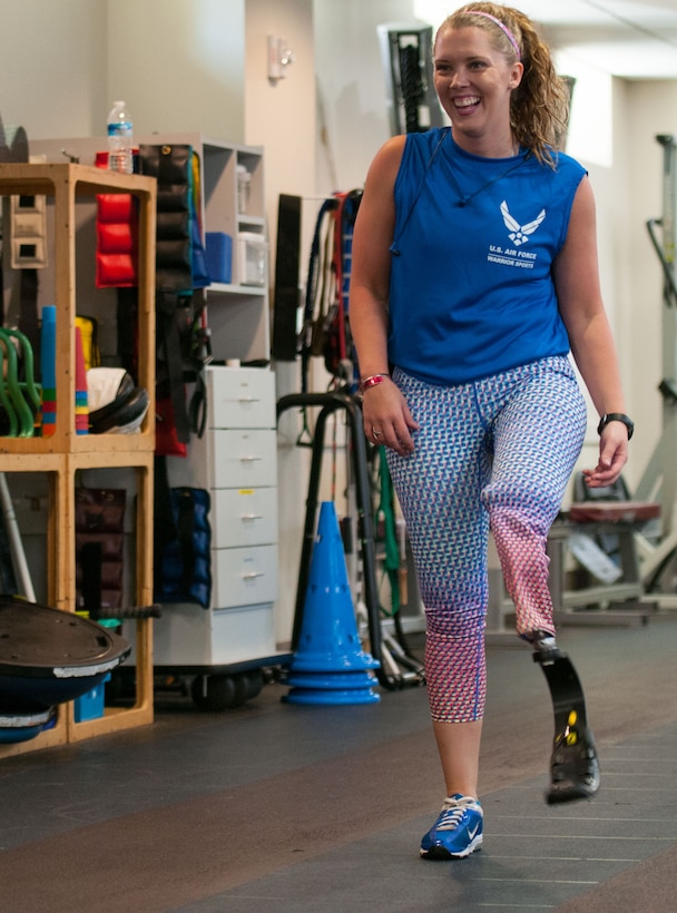 Heather Carter, an above-knee amputee, walks with her prosthetic running blade on a track inside the Military Advanced Training Center at Walter Reed National Military Medical Center in Bethesda, Md., April 13, 2016. Carter, a medically retired senior airman, and other amputees receive physical and occupational therapy at the center as they work toward their goals. One of Carter’s goals is to return to competitive softball. (U.S. Air Force photo/Sean Kimmons)
