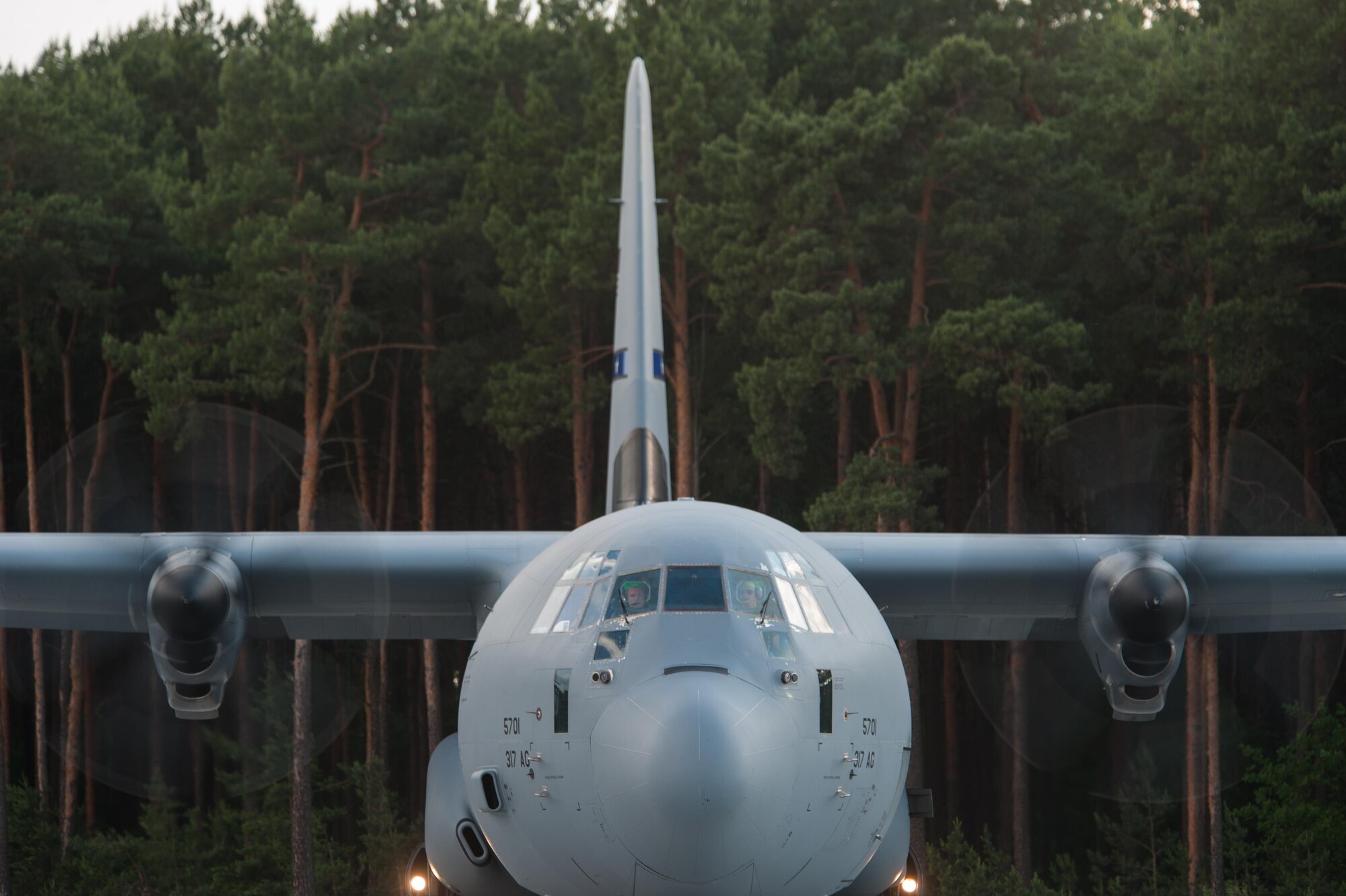 A U.S. Air Force C-130J Super Hercules and crew from Dyess Air Force Base, Texas wait to receive passengers at the Bydgoszcz Airport, Poland during Exercise Swift Response 16, June 8, 2016. Exercise SR16 is one of the premier military crisis response training events for multinational airborne forces in the world, the exercise has more than 5,000 participants from 10 NATO nations. (U.S. Air Force photo by Master Sgt. Joseph Swafford/Released)