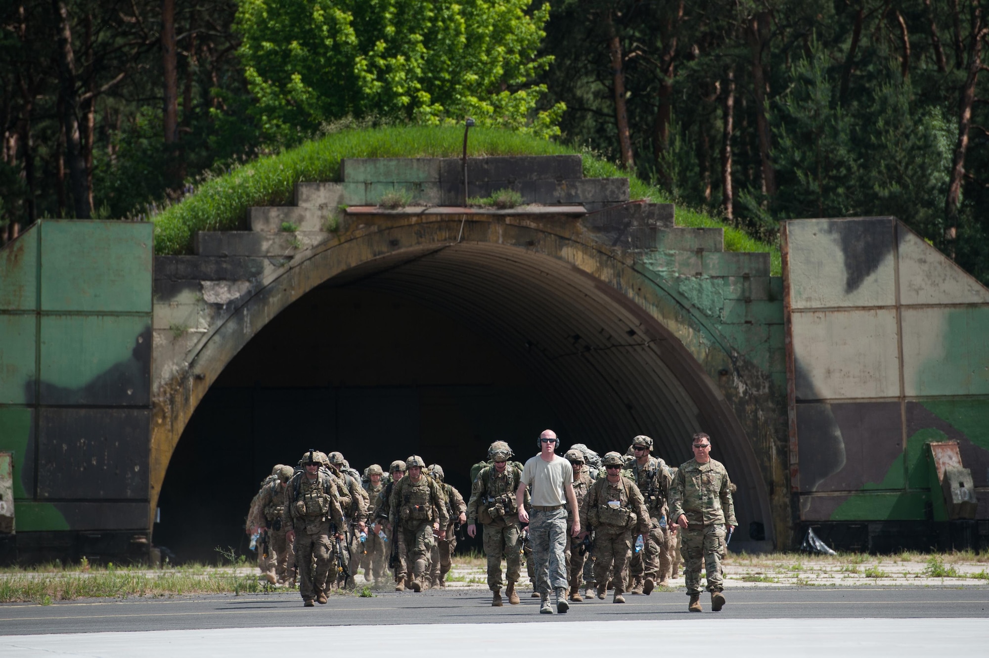 Senior Airman Guy Reeves, 921st Contingency Response Squadron aerial porter, guides a group of U.S. Soldiers assigned to the 82nd Airborne Division onto a C-130J Super Hercules during Exercise Swift Response 16 at the Bydgoszcz Airport, Poland, June 9, 2016. Exercise SR16 is one of the premier military crisis response training events for multinational airborne forces in the world, the exercise has more than 5,000 participants from 10 NATO nations. (U.S. Air Force photo by Master Sgt. Joseph Swafford/Released)