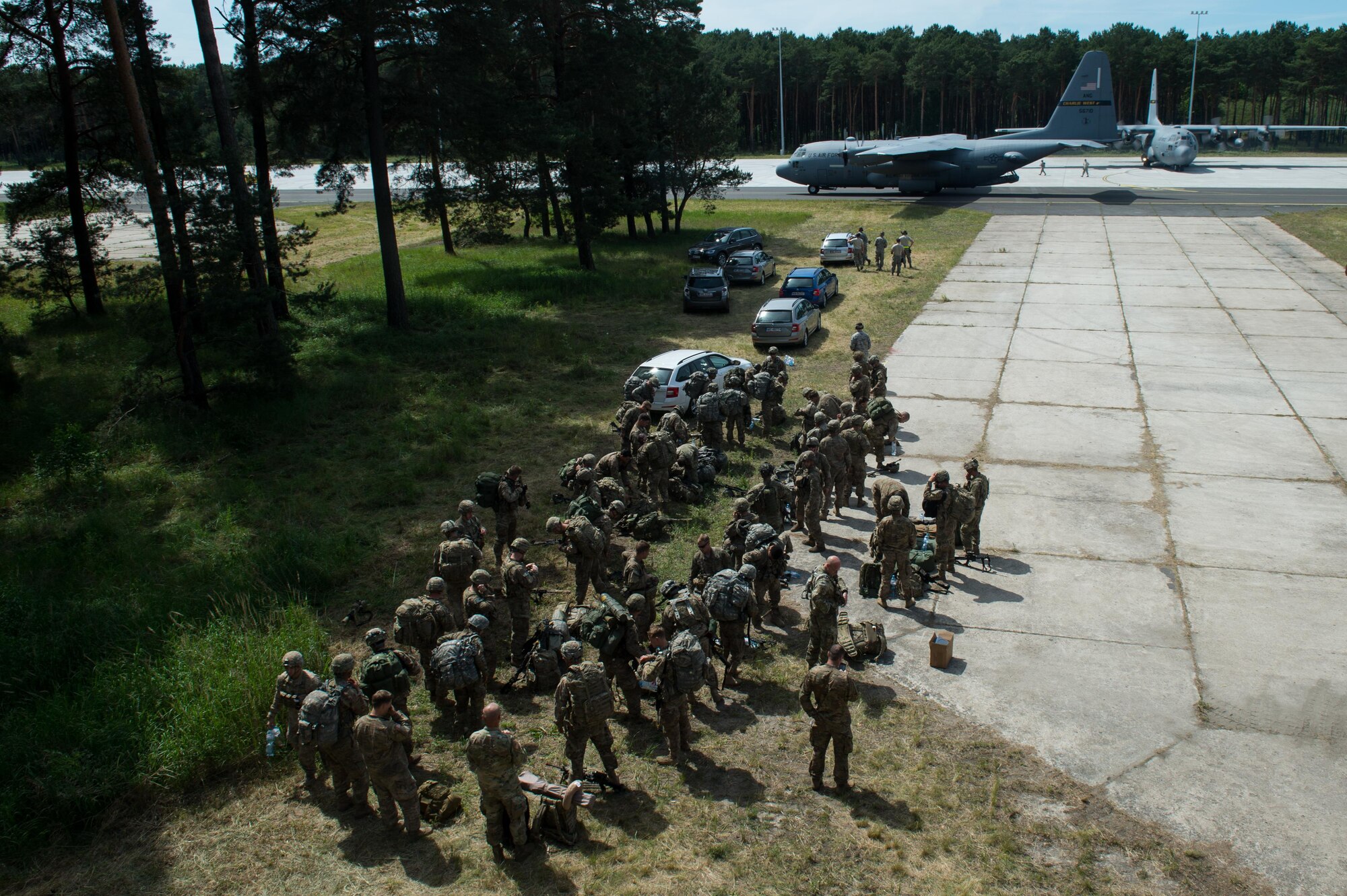 U.S. Soldiers assigned to the 82nd Airborne Division prepare to board a C-130 Hercules during Exercise Swift Response 16 at the Bydgoszcz Airport, Poland, June 9, 2016. Exercise SR16 is one of the premier military crisis response training events for multinational airborne forces in the world, the exercise has more than 5,000 participants from 10 NATO nations. (U.S. Air Force photo by Master Sgt. Joseph Swafford/Released)
