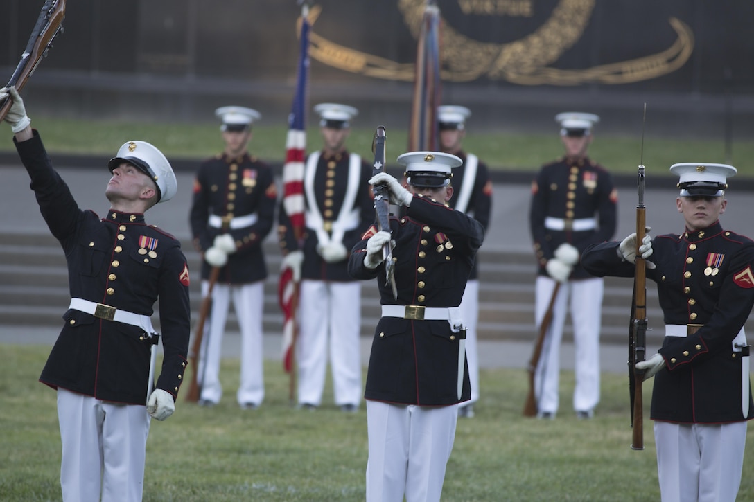 The Silent Drill Platoon, Marine Barracks Washington, D.C., performs during the Sunset Parade at the Marine Corps War Memorial, Arlington, Va., Jun. 15, 2016. The guest of honor for the parade was the Honorable Ray Mabus, Secretary of the Navy, and the hosting official was Gen. Robert B. Neller, commandant of the Marine Corps. (Official Marine Corps photo by Cpl. Chi Nguyen/Released)