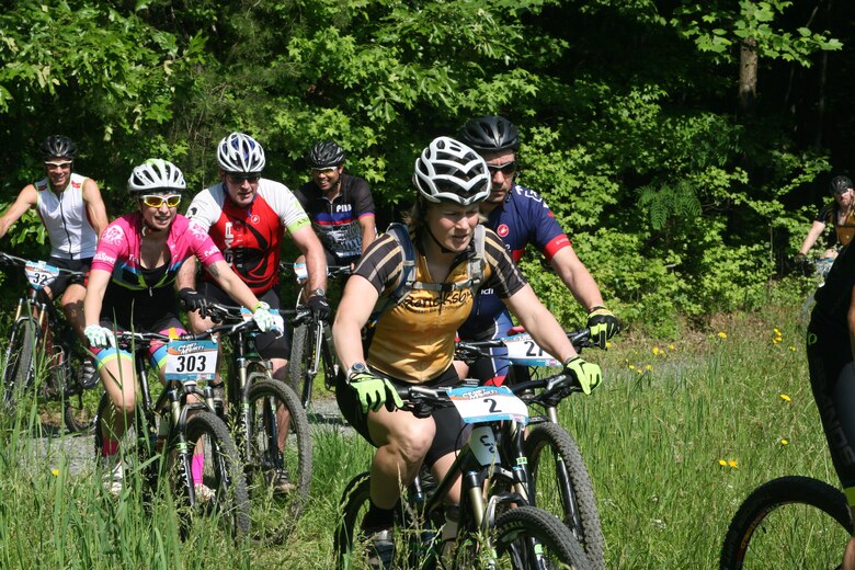 Cyclists ride to the start of the 2016 Cranky Monkey bike race, an endurace race in which riders attempt to complete as many nine-mile loops as possible between race start and finish (10 a.m. and 4 p.m.). More than 200 riders registered for the race. Riders could also sign up to compete in a cross-country option: one, two, or three nine-mile loops in the fastest time.