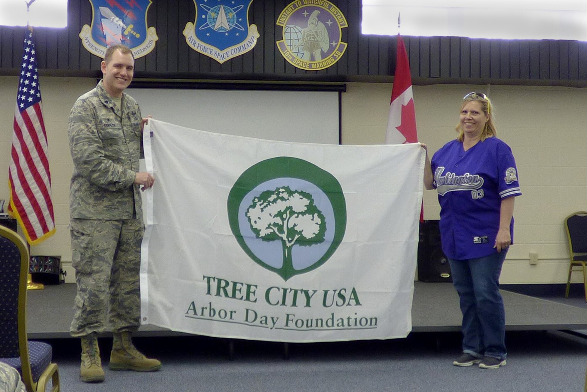 Lt. Col. John Koehler, 10th Space Warning Squadron commander, participates in the Tree City U.S.A. presentation at Cavalier Air Force Station, N.D. on June 3, 2016. The installation celebrated Arbor Day by planting trees and flowers, had a site picnic and recognizing the importance of being “green.” (Courtesy photo)