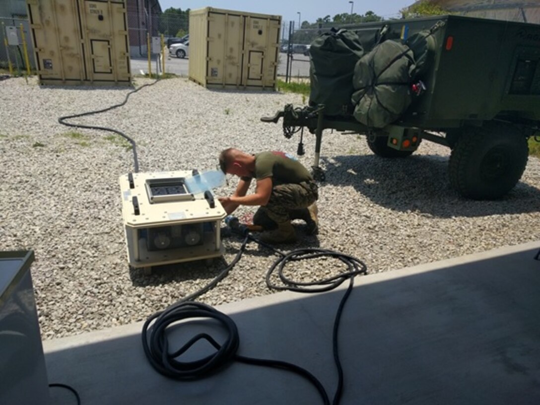 Private First Class Christophe Martz, a Marine attached to Basic Refrigeration and Air Conditioning Technician course 3-16 (BRACT 3-16) aboard Camp Lejeune, N.C.; uses a multimeter to ensure his source voltage is correct prior to connecting his Environmental Control Unit (ECU) to the Mobile Electric Power Distribution-Replacement (MEPDIS-R) panel.
