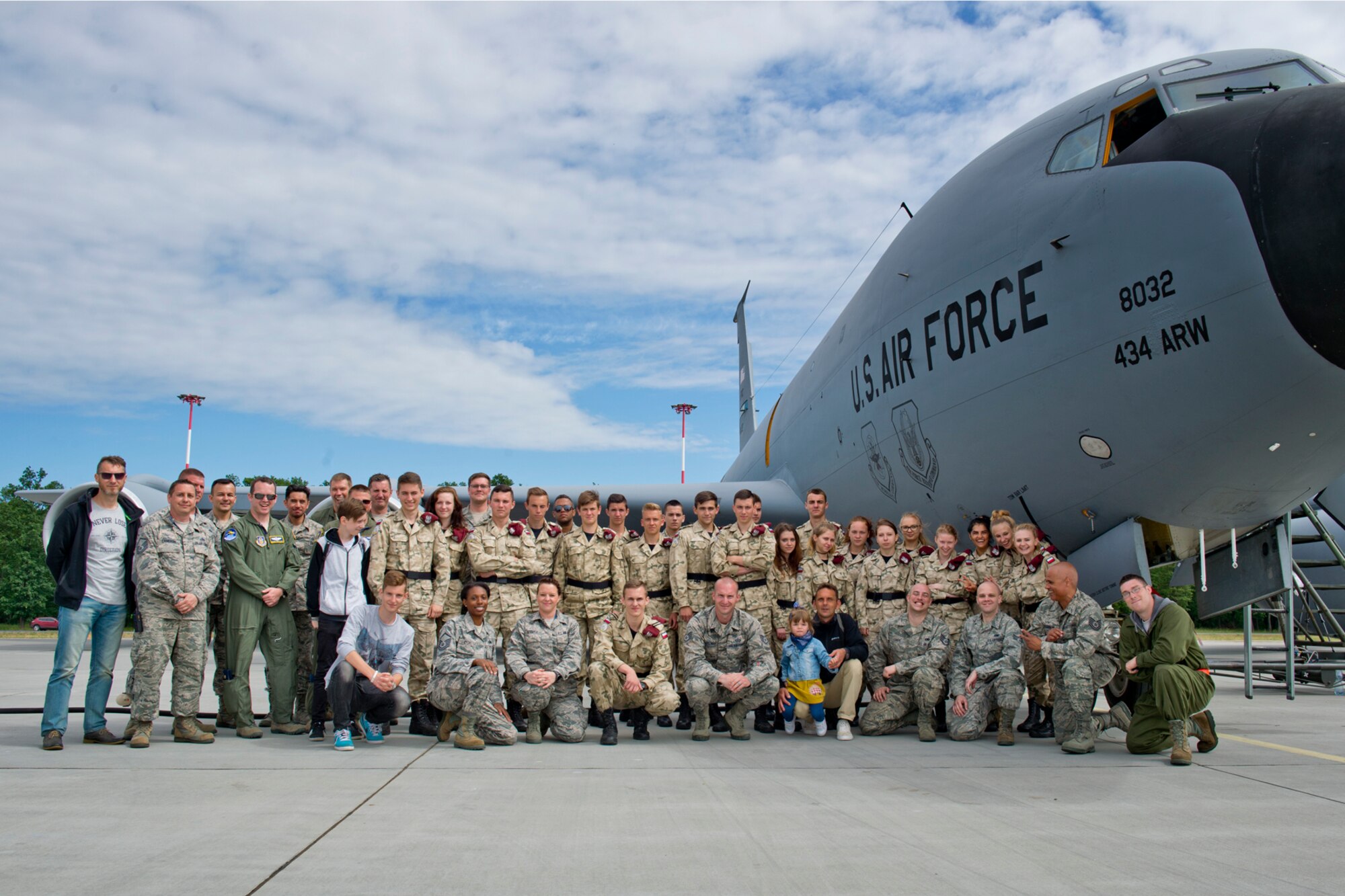 High school students from a military class at Adam Mickiewicz High School Complex, Kleczew, Poland, and U.S. Air Force Airmen pose for a group photo after at Powidz Air Base, Poland, where the 434th and 100th Air Refueling Wings are based while taking part in Baltic Operations 2016, June 9, 2016. This event allowed a younger generation from Poland to interact with U.S. Airmen and see firsthand how the U.S. Air Force operates. (U.S. Air Force photo/Senior Airman Erin Babis)