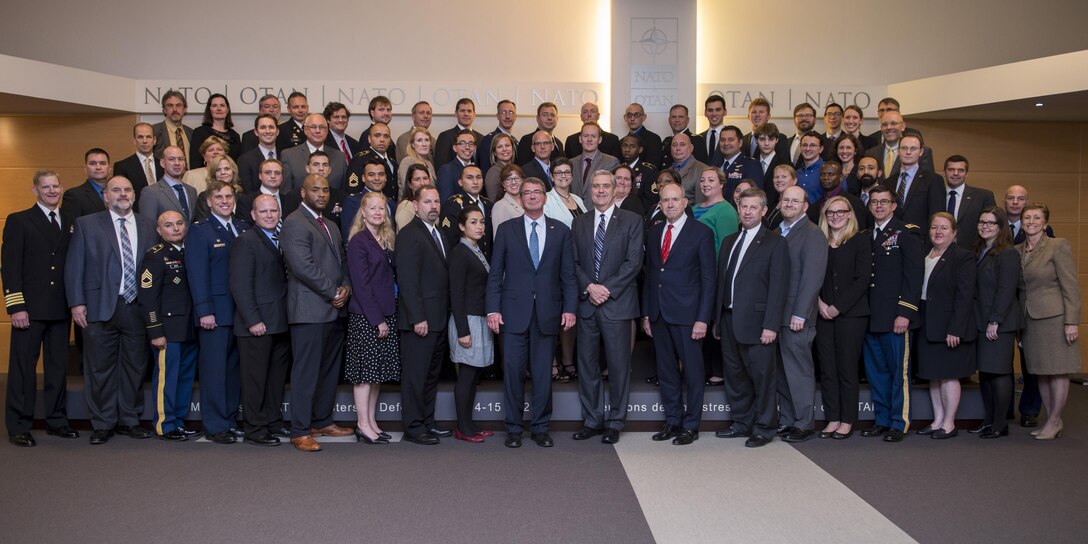 Defense Secretary Ash Carter, center front, stands for a photo with members of the U.S. mission staff at NATO headquarters in Brussels, June 15, 2016. DoD photo by Staff Sgt. Brigitte N. Brantley