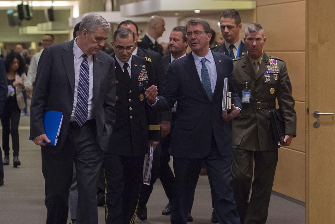 Defense Secretary Ash Carter walks with U.S. Ambassador to NATO Douglas E. Lute, left, and Army Gen. Curtis M. Scaparrotti, second from left, commander of U.S. European Command and NATO’s supreme allied commander for Europe, at NATO headquarters in Brussels, June 15, 2016. DoD photo by Air Force Senior Master Sgt. Adrian Cadiz