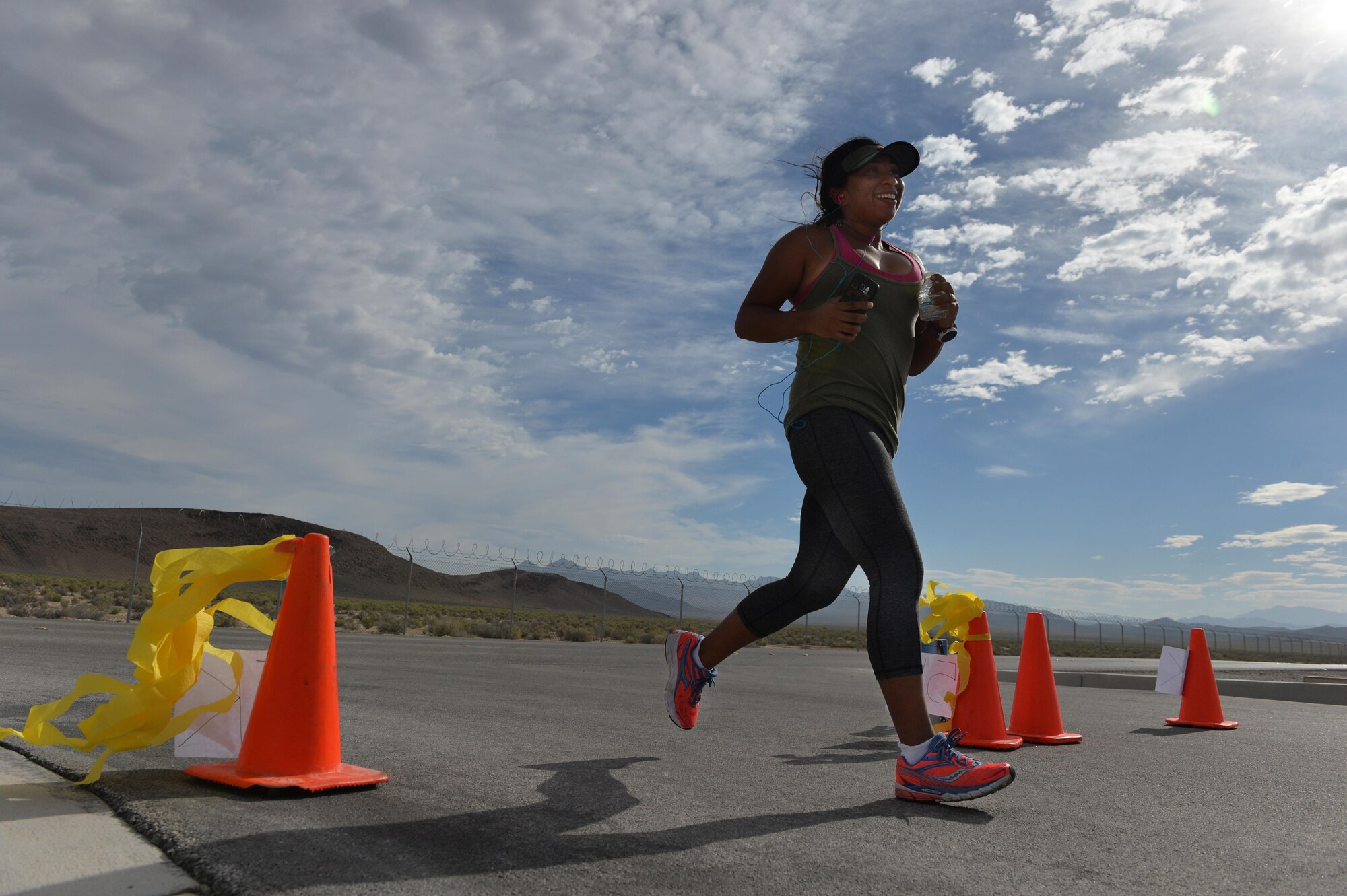An Airman assigned to the 432nd Wing/ 432nd Air Expeditionary Wing at Creech Air Force Base, Nevada, runs during a 5k and 10 k race June 10, 2016.To help promote physical readiness, obstacle courses, races and unit workout sessions are organized on a regular basis at Creech. (U.S. Air Force photo by Airman 1st Class Kristan Campbell/Released).