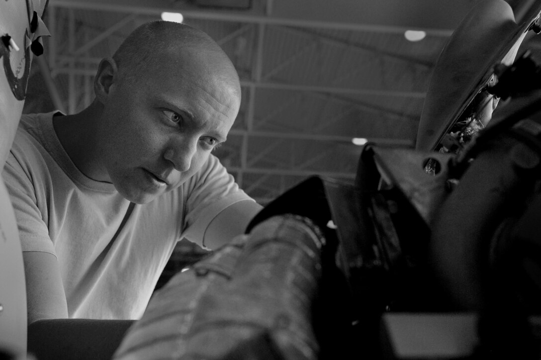 A 432nd Aircraft Maintenance Squadron crew chief inspects and repairs an MQ-1 Predator June 10, 2016, at Creech Air Force Base, Nevada. The 432nd AMXS crew chiefs provide maintenance support to more than 40 MQ-1 and MQ-9 Reapers used by aircrews in global operations 24/7/365. (U.S. Air Force photo by Airman 1st Class Kristan Campbell/Released).