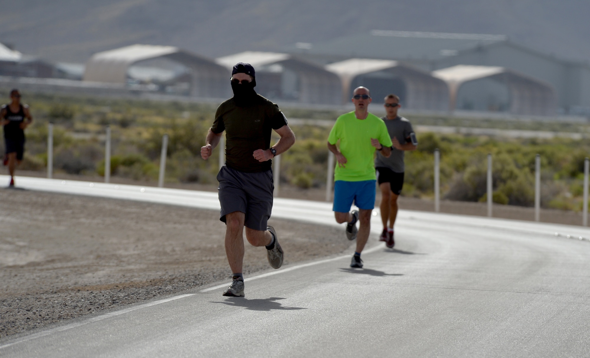 Members of the 432nd Wing/432nd Air Expeditionary Wing at Creech Air Force Base, Nevada, participate in a 5k and 10 k run June 10, 2016. To help promote physical readiness, obstacle courses, races and unit workout sessions are organized on a regular basis at Creech. (U.S. Air Force photo by Airman 1st Class Kristan Campbell/Released).