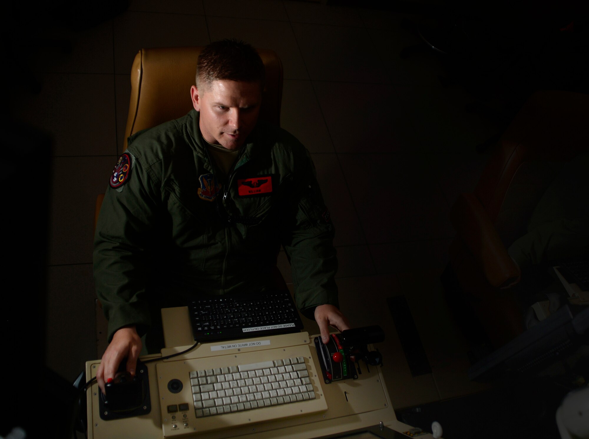 Tech. Sgt. William, 432nd Wing/432nd Air Expeditionary Wing sensor operator, flies a simulated mission June 10, 2016, at Creech Air Force Base, Nevada. The 432nd WG trains and deploys MQ-1 Predator and MQ-9 Reaper aircrews in support of global operations 24/7/365. (U.S. Air Force photo by Senior Airman Christian Clausen/Released)