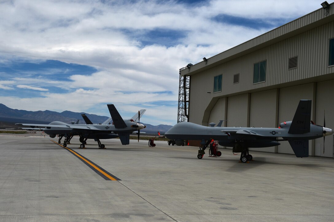 At Creech Air Force Base, Nevada, Airmen of the 432nd Wing/ 432nd Air Expeditionary Wing win today’s fight through MQ-1 Predator and MQ-9 Reaper operations, and also prepare for tomorrow by gathering and synthesizing information critical to remotely piloted aircraft missions. The gathering of information is made possible by the MQ-1 and MQ-9 persistent attack and reconnaissance combat missions flown from Creech and the training conducted by the units. (U.S. Air Force photo by Airman 1st Class Kristan Campbell/Released)