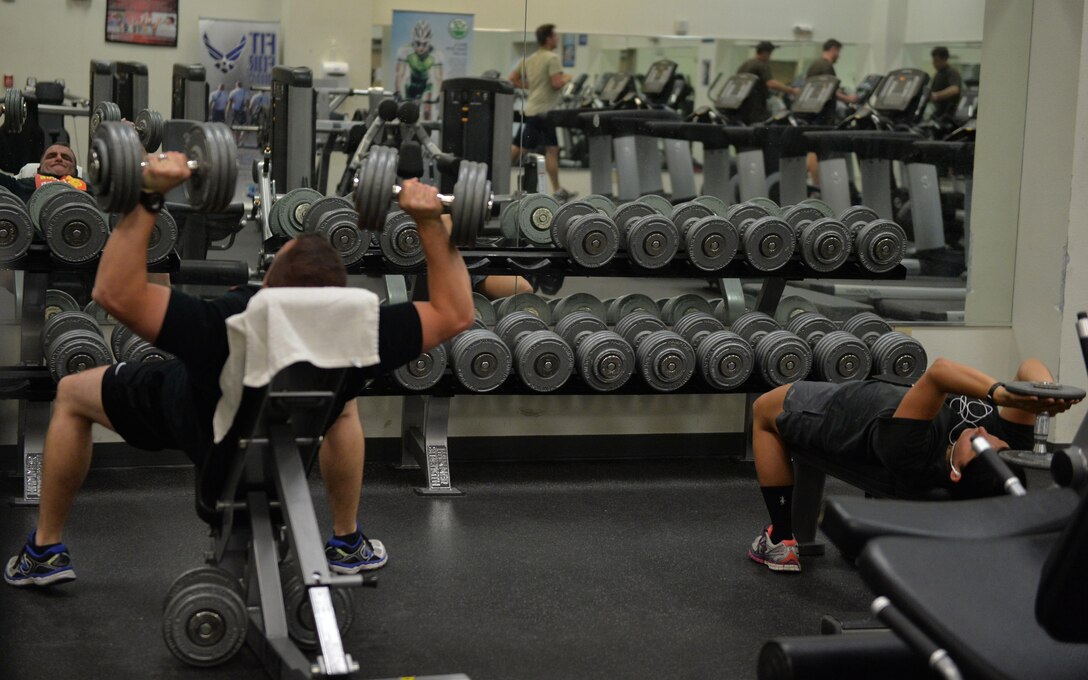 Airmen of the 432nd Wing/ 432nd Air Expeditionary Wing lift weights to stay in top physical shape at the Predator Fitness Center June 6, 2016, at Creech Air Force Base, Nevada. Since Creech AFB is located approximately 3,133 feet above sea level in hot desert terrain, Airmen must intensely train to maintain physical fitness. (U.S. Air Force photo by Airman 1st Class Kristan Campbell/Released)