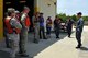 Petty Officer 1st Class Mark Vanwyck (right) briefs commanders and their Honorary Commanders prior to a tour of the Cooper River at Joint Base Charleston, S.C., June 13, 2016. The tour allowed leaders to learn about the unique water mission the Navy shares with the Air Force and see first-hand what it is like to patrol the harbor. (U.S. Air Force photo/Tech. Sgt. Renae Pittman)