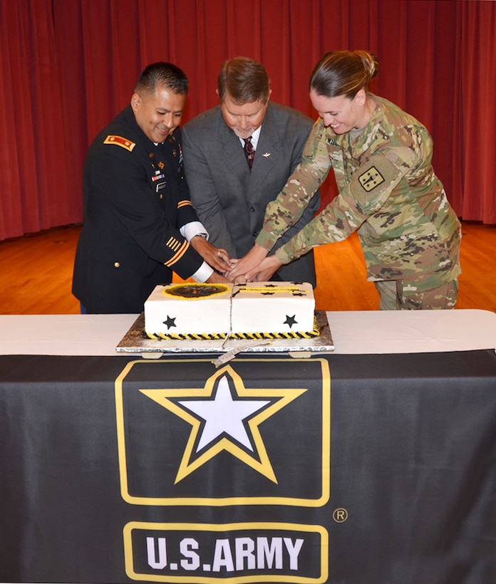 Defense Logistics Agency Aviation celebrated the Army’s 241st Birthday June 15, 2016 in the Center Restaurant on Defense Supply Center Richmond, Virginia.  Pictured cutting the cake are: Army Maj. Alex Shimabukuro, event master of ceremonies, left; Paul Hughes, deputy director DLA Aviation Customer Operations and guest speaker, center; and Army Spec. Jessica Williams, Fort Lee, Virginia 392nd Army Band member and the youngest Soldier present, right. 