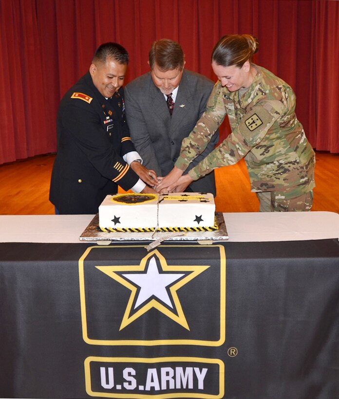 Defense Logistics Agency Aviation celebrated the Army’s 241st Birthday June 15, 2016 in the Center Restaurant on Defense Supply Center Richmond, Virginia.  Pictured cutting the cake are: Army Maj. Alex Shimabukuro, event master of ceremonies, left; Paul Hughes, deputy director DLA Aviation Customer Operations and guest speaker, center; and Army Spec. Jessica Williams, Fort Lee, Virginia 392nd Army Band member and the youngest Soldier present, right. 