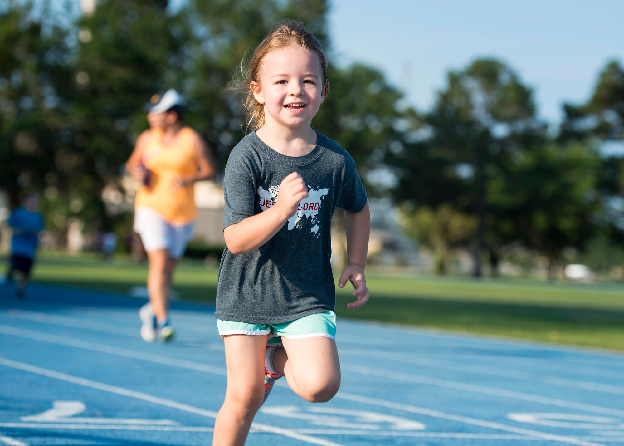 Taylin Edwards, daughter of U.S. Air Force Staff Sgt. Michael Edwards, 723d Aircraft Maintenance Squadron instrument and flight control system supervisor, sprints during the Tiger Run, June 11, 2016, at Moody Air Force Base, Ga. The 12-hour relay attracted more than 10 teams, with participants running more than 2,000 total laps. (U.S. Air Force photo by Airman 1st Class Janiqua P. Robinson/Released)