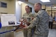 U.S. Air Force Capt. Aubrie Wnek, 17th Medical Support Squadron pharmacy element chief, Lt. Col. Bernard VanPelt, 17th MDSS Commander, and Col. Michael Downs, 17th Training Wing Commander, cut the ribbon during the ceremony for the new medsafe drop box at the Ross Medical Clinic Pharmacy on Goodfellow Air Force Base, Texas, June 13, 2016. Goodfellow members can now turn in unused prescription medication year round. (U.S. Air Force photo by Airman 1st Class Chase Sousa/Released)