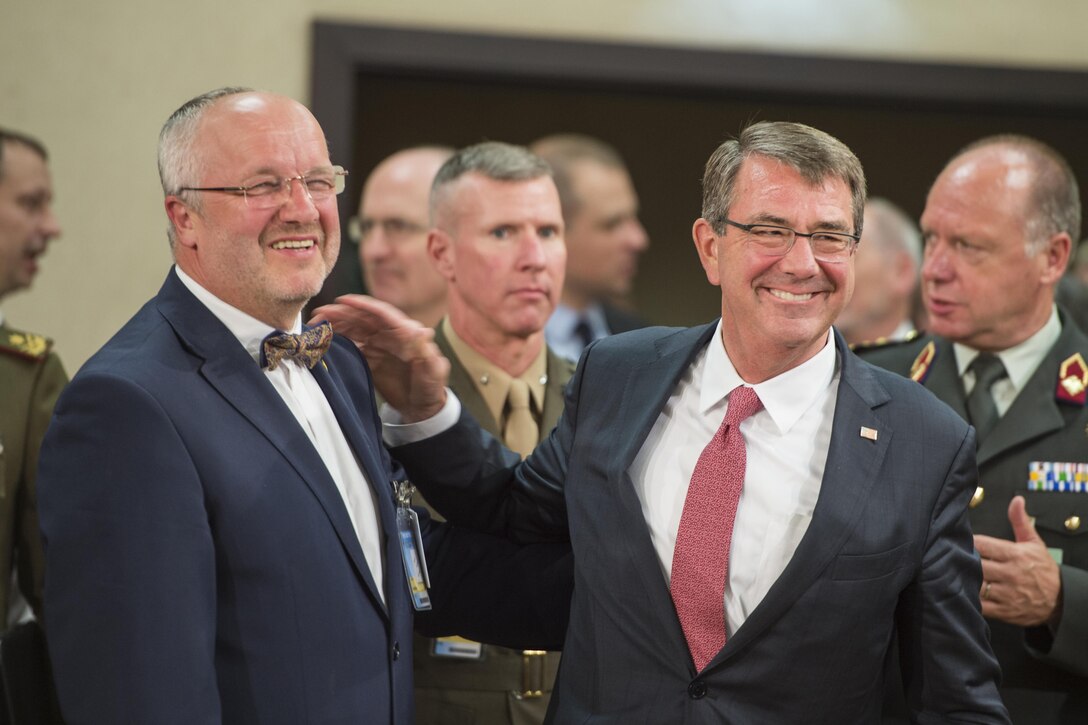 Defense Secretary Ash Carter exchanges greetings with Lithuanian Defense Minister Juozas Olekas while attending the North Atlantic Council meeting at NATO headquarters in Brussels, June 14, 2016. DoD photo by Staff Sgt. Brigitte N. Brantley