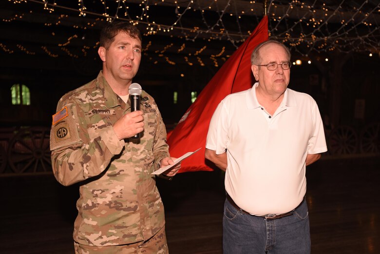 Lt. Col. Stephen Murphy, U.S. Army Corps of Engineers Nashville District commander, congratulates Jim Davis, former project manager for the Tennessee River Area, while presenting him the Distinguished Civilian Employees Award during Engineering Day Picnic festivities at Smiley Hollow in Ridgetop, Tenn., June 10, 2016. Davis culminated a 46-year career with the Corps of Engineers in January 2014.