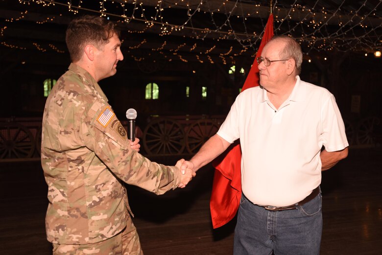 Lt. Col. Stephen Murphy, U.S. Army Corps of Engineers Nashville District commander, congratulates Jim Davis, former project manager for the Tennessee River Area, while presenting him the Distinguished Civilian Employees Award during Engineering Day Picnic festivities at Smiley Hollow in Ridgetop, Tenn., June 10, 2016. Davis culminated a 46-year career with the Corps of Engineers in January 2014.