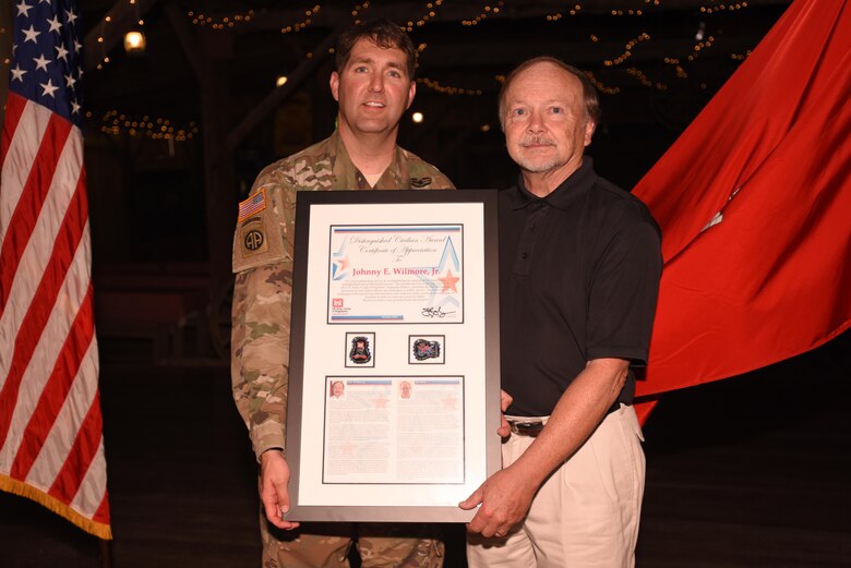 Lt. Col. Stephen Murphy, U.S. Army Corps of Engineers Nashville District commander, congratulates Johnny Wilmore Jr., former Construction Branch chief, while presenting him the Distinguished Civilian Employees Award during Engineering Day Picnic festivities at Smiley Hollow in Ridgetop, Tenn., June 10, 2016. Wilmore culminated a 40-year career with the Corps of Engineers in November 2013.