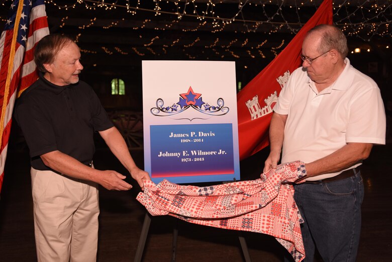 Lt. Col. Stephen Murphy, U.S. Army Corps of Engineers Nashville District commander, congratulates Jim Davis, former project manager for the Tennessee River Area, and Johnny Wilmore Jr., former Construction Branch chief, while presenting them the Distinguished Civilian Employees Award during Engineering Day Picnic festivities at Smiley Hollow in Ridgetop, Tenn., June 10, 2016.