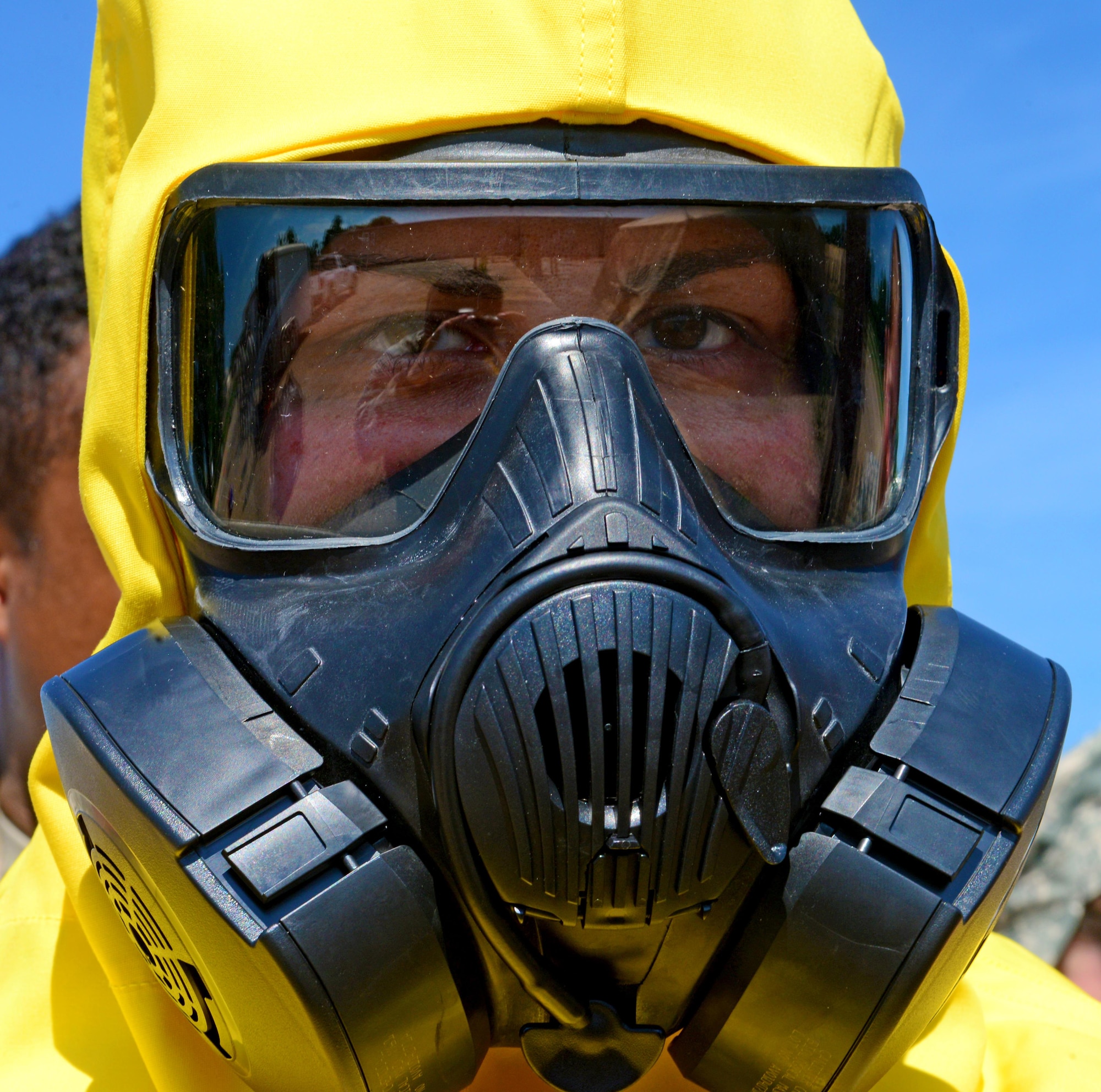 Airman 1st Class Melanie Martine, emergency management apprentice, waits for instructions during a decontamination training exercise for the emergency management support team at Barksdale Air Force Base, La., June 6, 2016. The EMST trains every month to ensure they are ready when duty calls. (U.S. Air Force photo/Senior Airman Luke Hill)