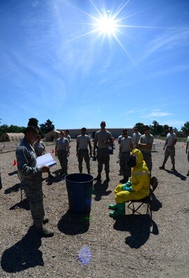 Airman 1st Class Alexander Trippett, 2nd Civil Engineer Squadron explosive ordnance disposal apprentice, briefs the emergency management support team on a decontamination exercise at Barksdale Air Force Base, La., June 6, 2016. The EMST is made up of Airmen from various offices throughout 2nd CES and is augmented to aid Barksdale’s emergency management team during an emergency situation. (U.S. Air Force photo/Senior Airman Luke Hill)