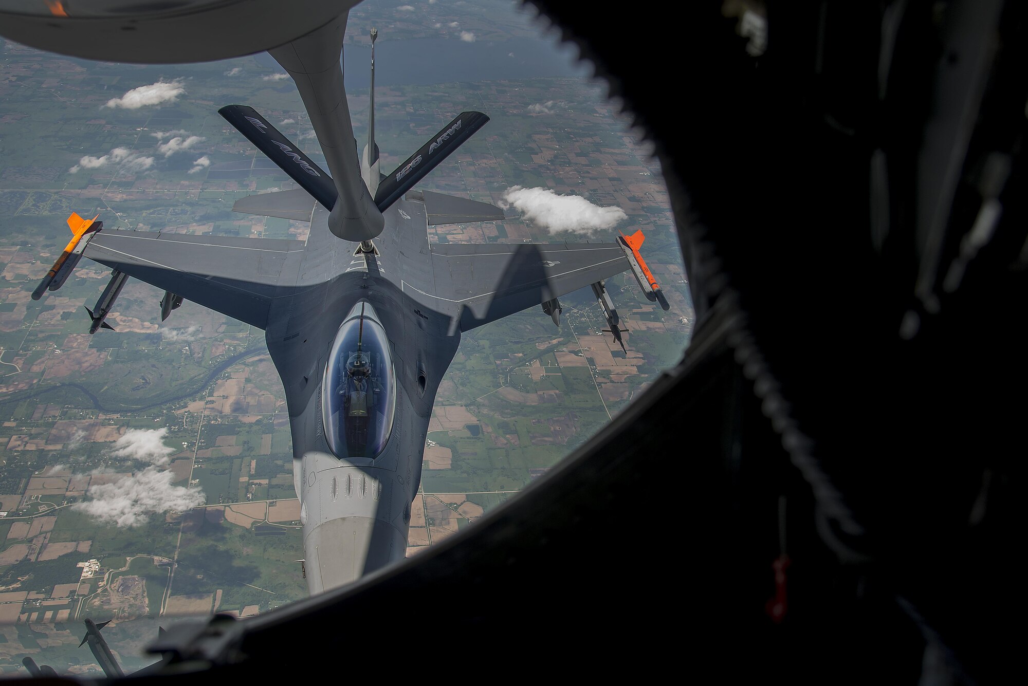 An F-16 jet from the Fighter Wing of the Wisconsin Air National Guard participates in an air refueling mission June 3, 2016. The mission was a training sortie focusing on maintain aircrew readiness in conjunction with the 906th Air Refueling Squadron and the 126th Air Refueling Wing. (U.S. Air Force Photo by Airman Daniel Garcia)