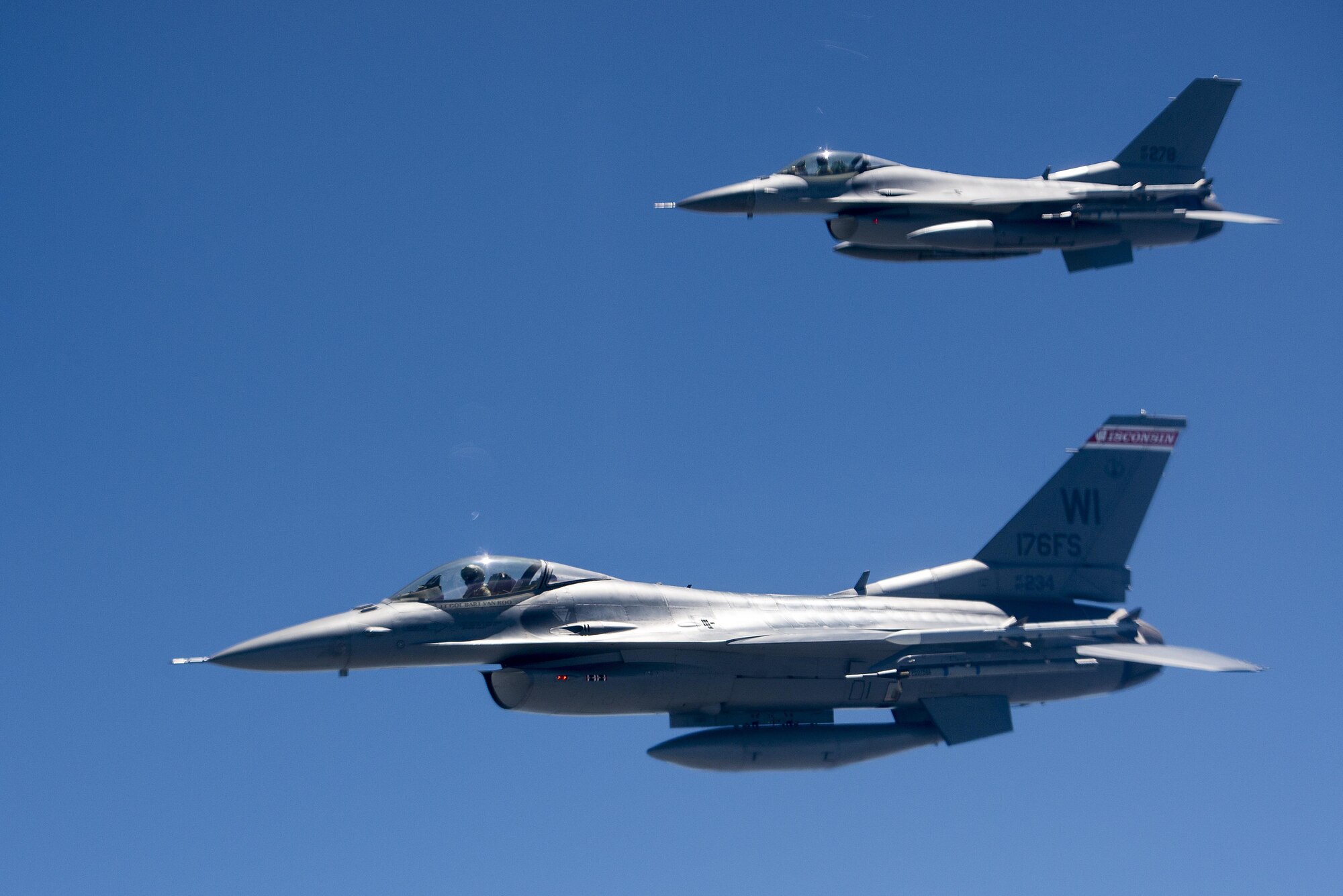 Two F-16 jets from the 115th Fighter Wing of the Wisconsin Air National Guard participate in a training focusing on maintaining aircrew readiness June 3, 2016. The jets were in formation with two KC-135s refueling eight F-16s. (U.S. Air Force Photo by Airman Daniel Garcia)