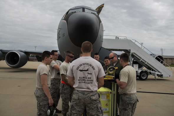 Captain Jeffrey Everett, 906th Air Refueling Squadron pilot, and members of the 126th Air Refueling Wing review the mission briefing to ensure success prior to an air refueling mission June 3, 2016 at Scott Air Force Base, Illinois. The mission was a training sortie focusing on maintain aircrew readiness in conjunction with the 115th Fighter Wing of the Wisconsin Air National Guard. (U.S. Air Force Photo by Airman Daniel Garcia)