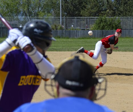 Senior Airman Devin Mooney, 321st Missile Squadron commander's support staff and Personnel Reliability Program monitor, pitches the ball during a Fort Collins league baseball game May 29, 2016, on a baseball field in Colorado. Mooney averages between 93 and 95 miles per hour on his fastball pitches. (U.S. Air Force photo by Senior Airman Jason Wiese)