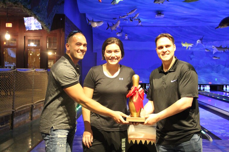 The Western Air Defense Sector wins the second annual USO Northwest All American Oh-Pin bowling tournament on May 24. The Golden Bowling Pin trophy was presented to Michael Doing (from right to left), Elisa Layton, David Bauld and Chris Worden (not pictured). The tournament raised over $1,000 for the USO Helping Hands program. (Courtesy photo by Kevin Iriarte, USO Northwest)